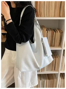 Minimalist soft leather tote bag, large capacity casual shoulder bag with small pouch detail.