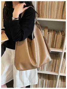 Vintage soft leather shoulder tote bag detail view, casual large capacity hobo bag for daily use.