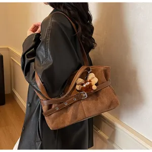 Winter vintage brown suede shoulder underarm bag with leather straps and cute plush pendant.