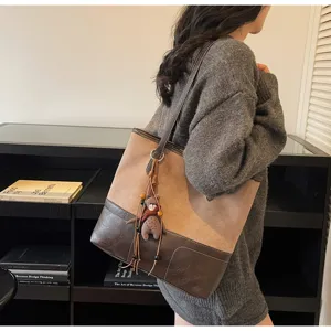 Stylish two-tone tote bag for women, large capacity suede shoulder bag with cute bear charm.