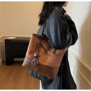 Detail view of women large capacity patchwork tote bag, brown leather shoulder bag.