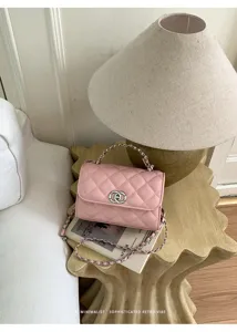 Pink quilted chain shoulder bag, classic luxury style mini crossbody bag with metal handle.