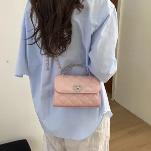 Pink quilted chain crossbody bag for women, stylish small shoulder bag with luxury metal handle.