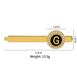 Detailed view of gold letter G brooch with rhinestones, vintage alloy collar pin showing size.