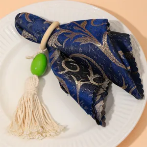 Elegante portasciugamani in tessuto blu e oro con perla in legno e nappina da tavolo