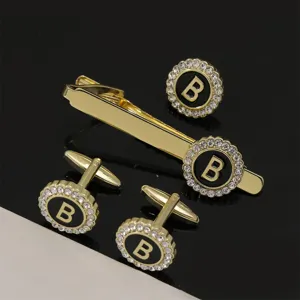 Men gold tone alloy letter B initial cufflink and tie clip set with crystal rhinestones.
