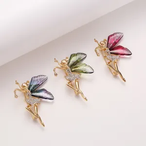 Exquisite rhinestone fairy brooch set with gradient wings and gold alloy finish.