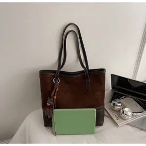 Brown suede tote bag for women, large capacity winter shoulder bag with cute bear pendant detail.