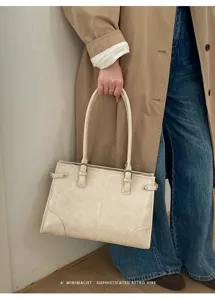Minimalist retro beige tote bag, large capacity shoulder bag for women daily commute.