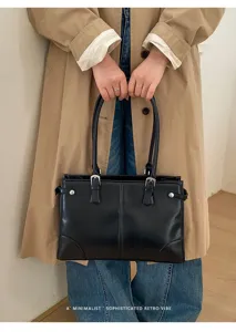 Retro minimalist black shoulder tote bag for women, stylish commuting handbag, large capacity.