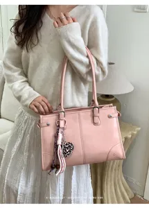 Classic pink PU leather shoulder bag with chic leopard heart charm, stylish commuter tote.