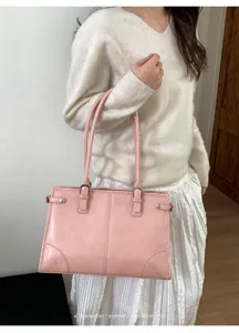 Pink retro shoulder tote bag with double handles, stylish commuter bag for daily use.
