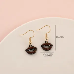Detailed close-up of Halloween vampire lips earrings, showing cute spooky design and size.