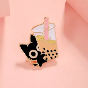 Close-up detail of a cute black cat boba tea enamel pin, stylish lapel badge accessory.