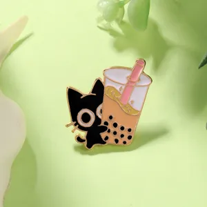 Close-up detail of the cute black cat and boba milk tea enamel lapel pin with gold plating.