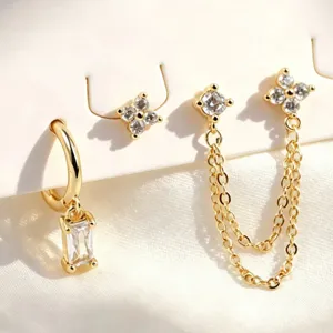 Gold plated three piece earring set featuring geometric chain pendants and sparkling rhinestone studs.