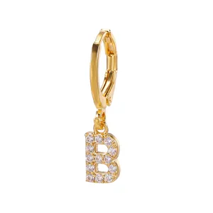 Detailed close-up of fashion gold-plated letter B hoop earring with sparkling cubic zirconia.