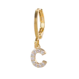 Gold-plated letter C pendant huggie hoop earring detailed close-up shot sparkling zircon.
