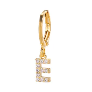 Gold plated letter E hoop earring with sparkling zircon stones, delicate fashion jewelry detail.