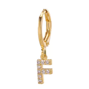Detail shot of gold-plated letter F pendant hoop earring with sparkling cubic zirconia stones.