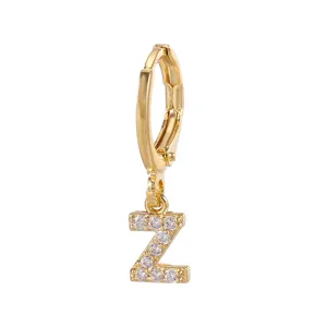 Close-up detail of gold plated letter Z hoop earring with sparkling crystal pavé stones.