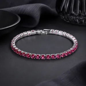 Stunning red zircon tennis bracelet in silver finish, elegant cubic zirconia link jewelry.