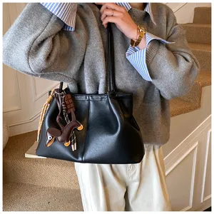 Casual women large capacity tote bag with stylish horse charm detail and shoulder strap for commute.