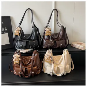Vintage large capacity PU leather multi-way shoulder backpack tote bag with cute bear pendant.