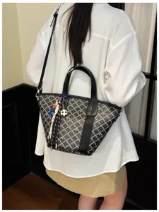 Korean style plaid bucket bag large capacity shoulder messenger handbag for women daily commute.