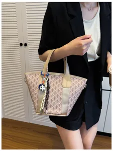 Detailed view of trendy Korean style bucket bag with geometric plaid pattern and charms