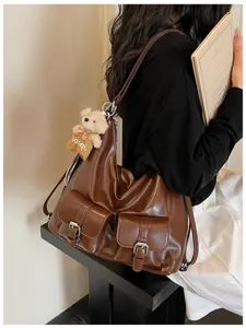 Vintage texture large capacity women backpack casual multi-use shoulder bag detail.
