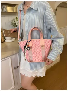 Chic pink chevron bucket bag for women, large capacity shoulder and crossbody purse.