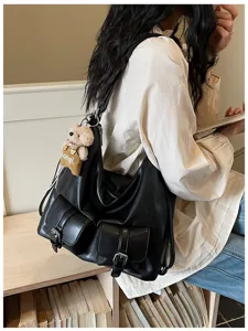 Retro black leather multi-purpose shoulder bag with dual pockets and cute bear pendant.