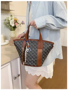 Trendy Korean style grid tote bucket bag featuring brown trim and chic charm pendant.