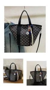 Black checkered tote bag with top handles and shoulder strap, stylish daily commuter bag.