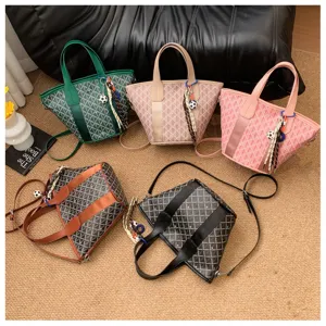 Detail view of colorful checkered tote bags with handles and charms on carpet background.