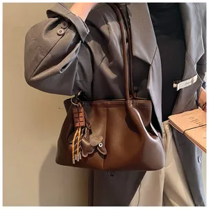 Brown PU leather tote bag with cute puppy charm and chocolate pendant, stylish daily shoulder bag.