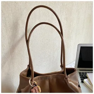 Brown PU leather tote bag detail, featuring double straps for women daily commute.