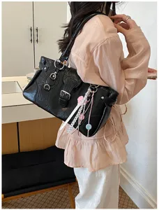 Black vintage style PU leather shoulder bag with chic metal buckles and cute charm detail.