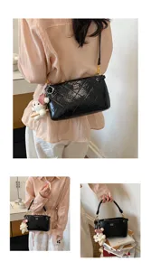 Chic quilted underarm bag for women, stylish black patent leather shoulder handbag.