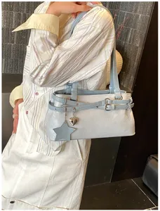 Stylish minimalist shoulder underarm bag for women, trendy large commuter tote design.