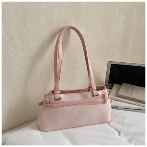 Detailed view of a trendy pink PU leather underarm shoulder bag with slim straps and belt decor.