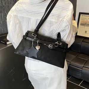 Stylish black leather underarm shoulder bag for women with chic straps and metal charms.