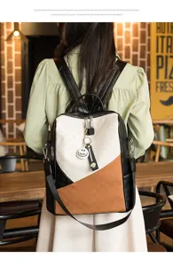 Mochila elegante de bloques de color para mujer, bolso casual de cuero patchwork chic.