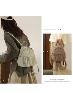 Nylon mini backpack for women, casual travel daypack with multiple pockets and top handle.