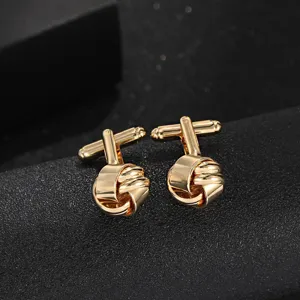Boutons de manchette nœud en métal doré pour hommes, accessoire élégant pour chemise habillée.