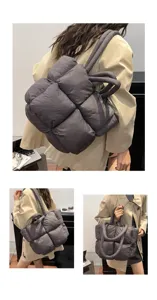 Detailed view of the dark grey padded puffer tote bag, soft space cotton material, quilted grid design.