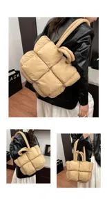 Detailed view of women padded quilted tote bag, soft puffer shoulder handbag in beige.