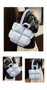 Light blue padded tote bag detail, soft quilted puffer handbag with double handles, casual style.