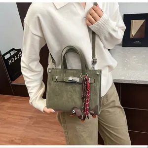Stylish green women crossbody shoulder bag retro PU leather handbag with cute dog charm.